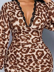 Close view of brown leopard print bodice and ruched waist from the front