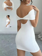 White off shoulder bodycon mini dress shown from the back with twisted back detail