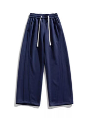 Men's navy blue loose-fit wide-leg pants with a drawstring waist and pockets.
