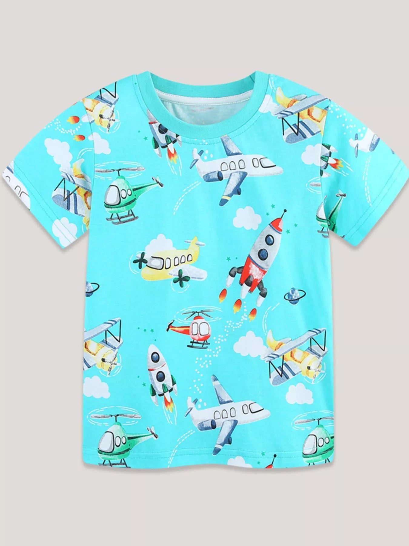 Front view of the aqua children's crew neck t-shirt with all-over airplanes rockets helicopters and clouds