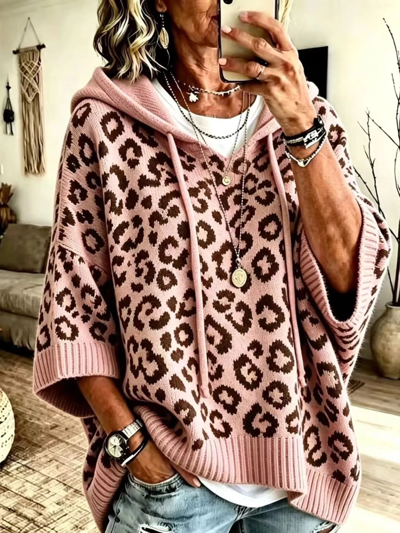 Pink leopard print oversized hooded knit sweater with drawstrings, front view on model