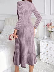Back view of light purple ribbed knit bodycon dress with ruffle hem indoors