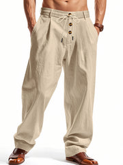 Men's light khaki loose-fit pants with a drawstring waist and pockets.