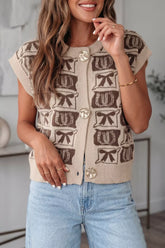 Front view of a beige and brown bow patterned button up sweater vest