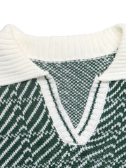Close-up of the white ribbed collar and V neck on the green geometric sweater
