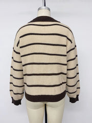 Back view on a mannequin of a cream and brown striped knit polo sweater.