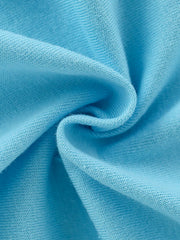 Close-up of soft sky blue cotton fabric texture with gentle folds