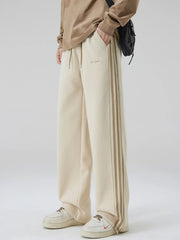Men's khaki relaxed-fit pants with side stripes, a drawstring waist and pockets.