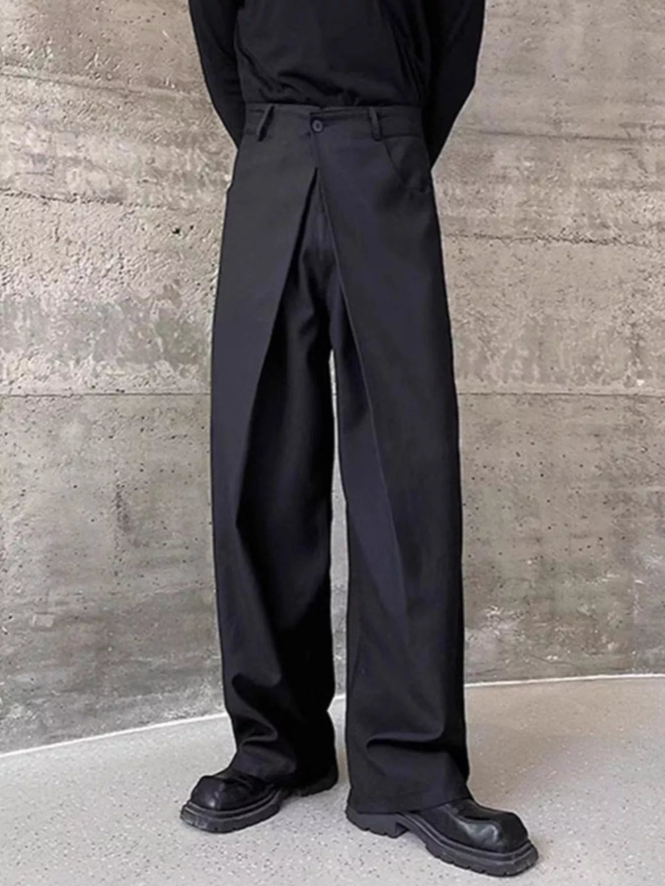 Men's black dress pants with a wide-leg cut.