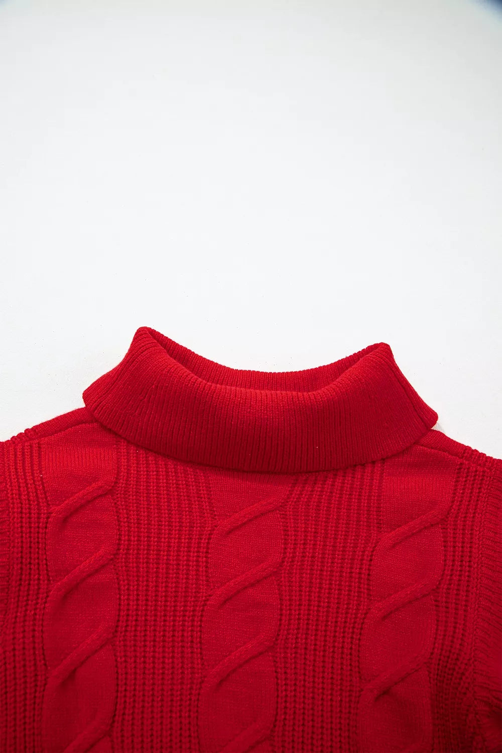 Close-up of the red cable knit turtleneck sweater back neckline