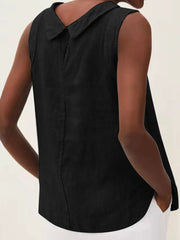 Back view of a black sleeveless top with a pointed collar and curved hem