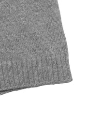 Close up of the gray ribbed hem and knit texture on the dropped shoulder sweater