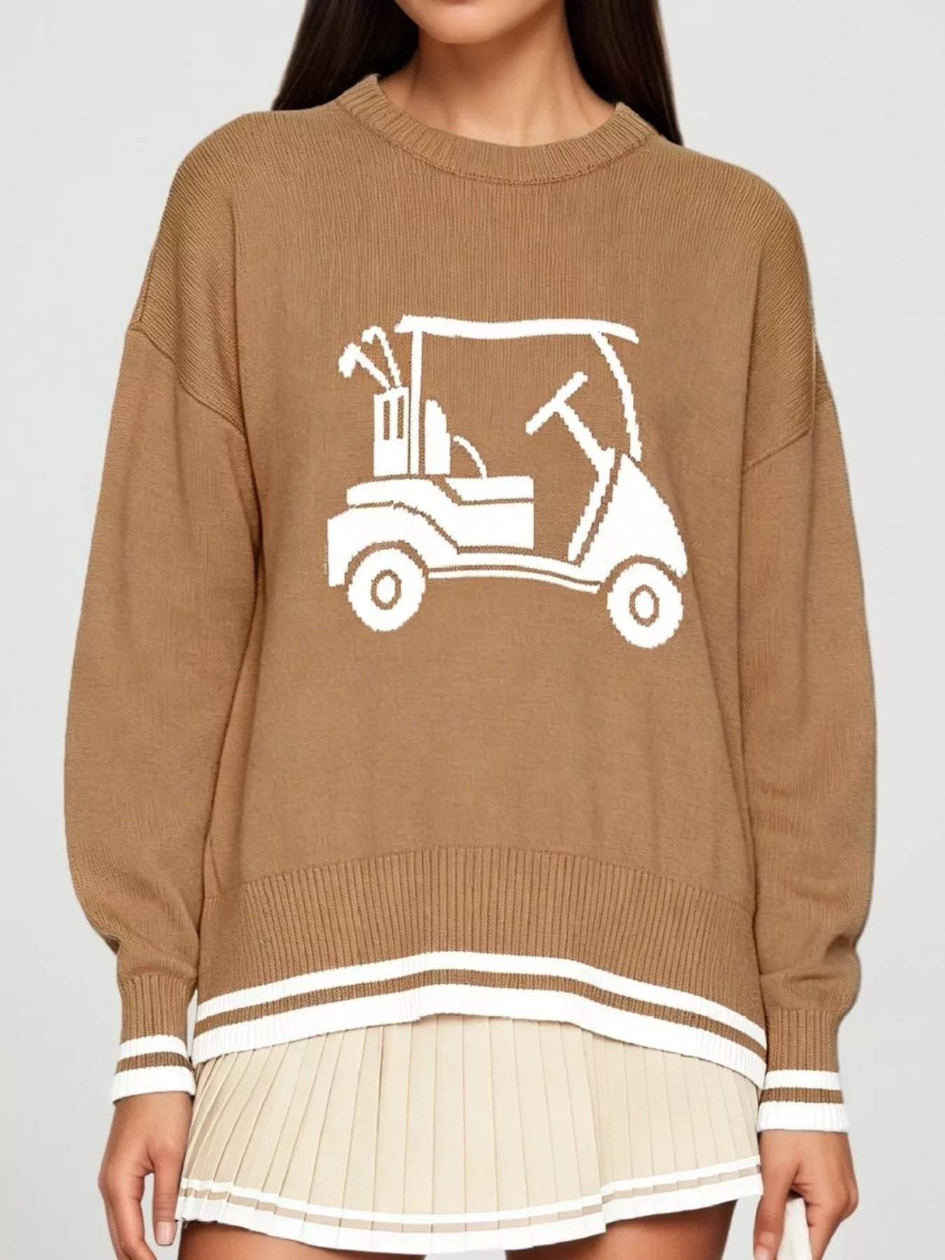 Front view of a khaki dropped shoulder sweater with a white golf cart graphic and striped trim.