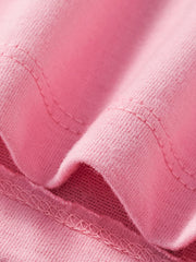 Close view of pink tee fabric and stitching detail on a children's unicorn ruffle sleeve shirt