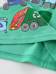 Close-up of the lower hem and red and green recycling truck print on the green children's T-shirt