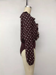 Mannequin side view of a coffee brown polka dot bodysuit with long sleeves