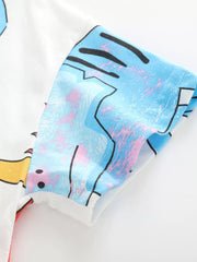 Close-up of the blue dinosaur print and stitched sleeve hem on the white tee