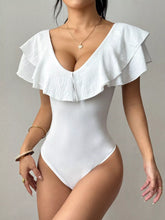 Front view of a white V neck bodysuit with layered ruffle trim