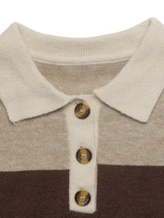 Close up of cream polo collar and tortoiseshell buttons on beige and brown sweater.