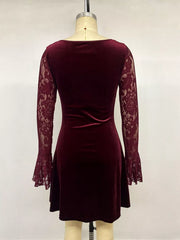 Back view of burgundy lace mini dress on mannequin with velvet skirt and lace sleeves