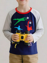 Front view of a dark navy children's long sleeve tee with colorful soccer player silhouettes