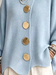 Close up of the sky blue cardigan gold buttons and scalloped hem