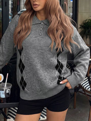 Front view of a gray polo collar sweater with black argyle panels down the sides