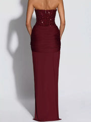 Red strapless sequin corset maxi dress on model, full length back view showing zip