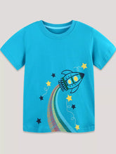 Sky blue children's round neck T-shirt with a rocket graphic trailing a rainbow trail among stars