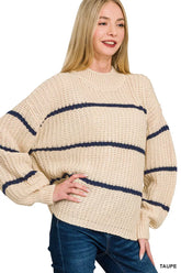 Cream oversize striped sweater with navy stripes worn with dark jeans studio