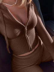 Close up of brown ribbed zip up hooded cardigan showing front zipper detail
