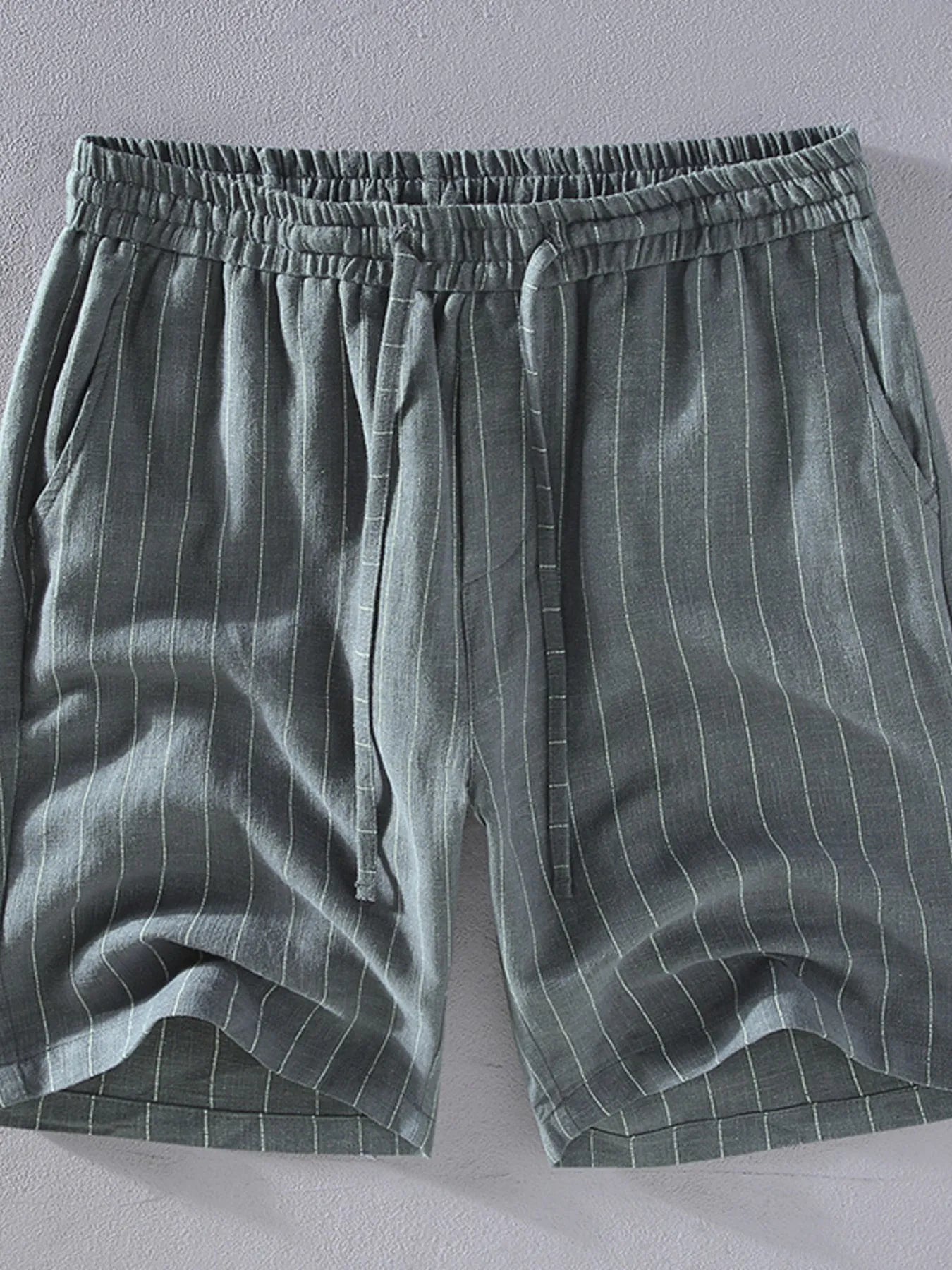 Men's grey striped shorts with a drawstring waist, available in plus sizes.