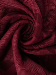 Burgundy floral mesh fabric swirl close up showing texture and pattern of mini dress
