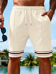 Men's apricot textured knit shorts with a drawstring waist and pockets.