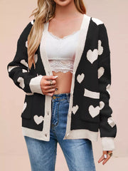 Black knit cardigan with white hearts and cream trim worn open