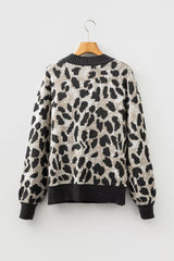 Flat lay back view of the gray and black leopard print baggy sweater on a hanger.