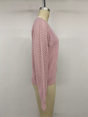 Side view on a mannequin of a pink V neck sweater with openwork long sleeves.
