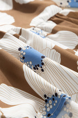 Blusa con mangas anudadas y estampado floral a rayas