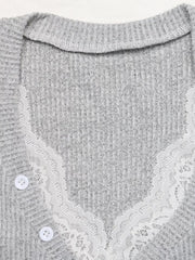Close-up detail of a light gray ribbed Henley top with lace-trimmed edges and white buttons