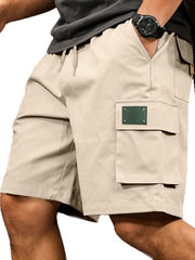 Men's apricot cargo shorts with a drawstring waist and pockets.