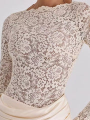 Close detail of ivory floral lace bodice and scalloped neckline on maxi dress