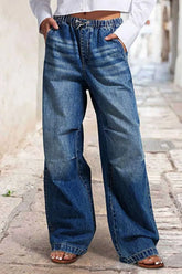 Women's wide-leg jeans with shirred detailing, a drawstring waist, and pockets.