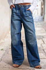 Women's wide-leg jeans with shirred detailing, a drawstring waist, and pockets.