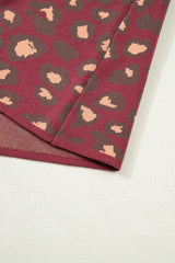 Close-up of the deep red leopard print knit top hem and lining
