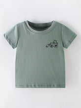 Front view of a sage children's short sleeve shirt with a small black cartoon excavator on the chest