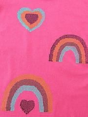 Close detail of sequin hearts and rainbows in turquoise orange and dark pink on pink tee