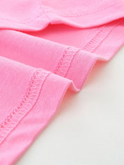 Close up of pink children's t-shirt hem stitching and smooth cotton fabric texture