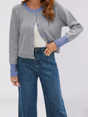 On-model front view of the gray cardigan with periwinkle trim and matching blue buttons