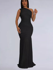Black one shoulder ruched bodycon maxi dress with flowing skirt, front view on model