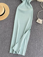 Lower skirt of mint ribbed knit midi dress showing side slit detail